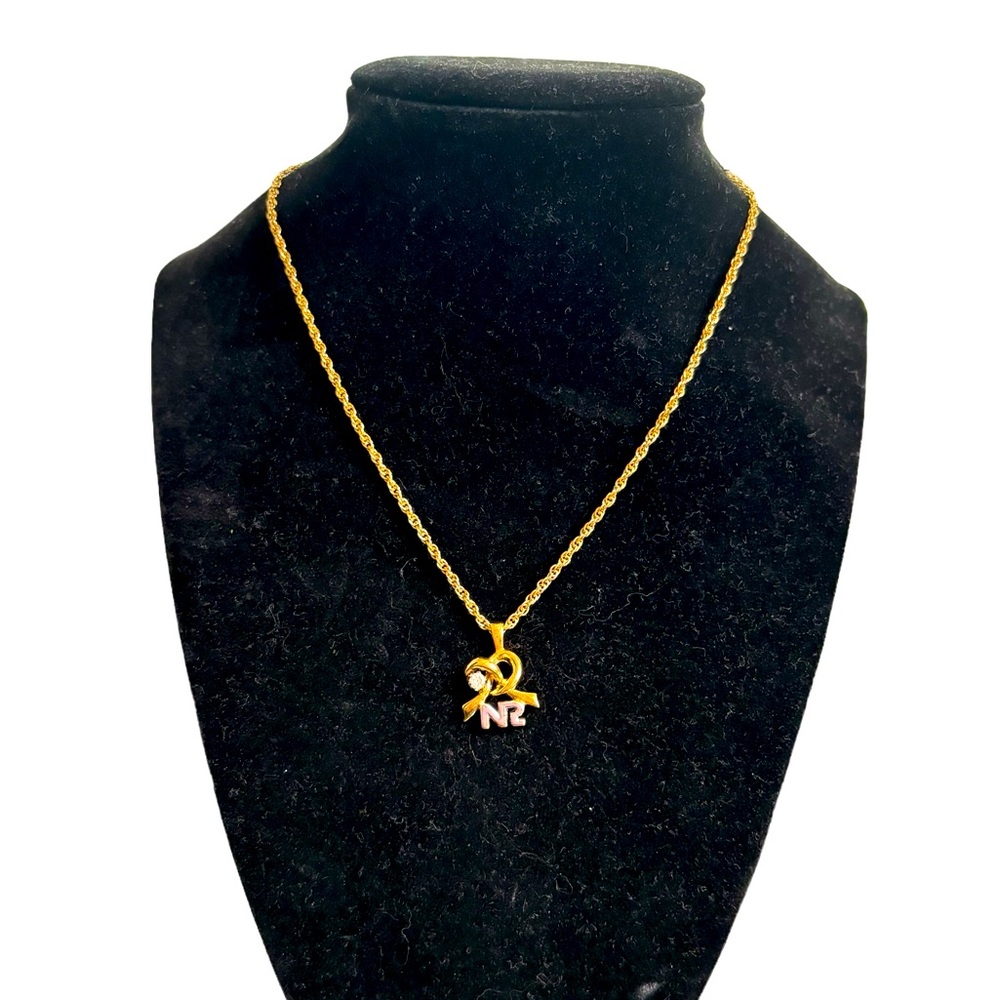 Nina Ricci vintage necklace. In excellent condition. Stud on knot 7.5”